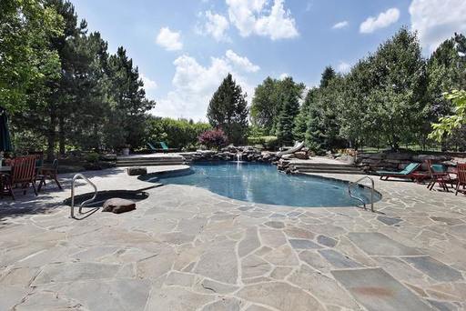 0bigstock-Swimming-Pool-With-Large-Stone-7213580-m